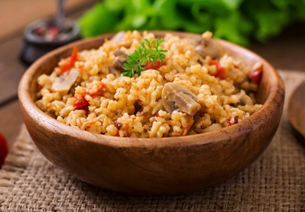 bulgur-with-chicken-mushrooms-tomatoes-wooden-bowl_2829-18434